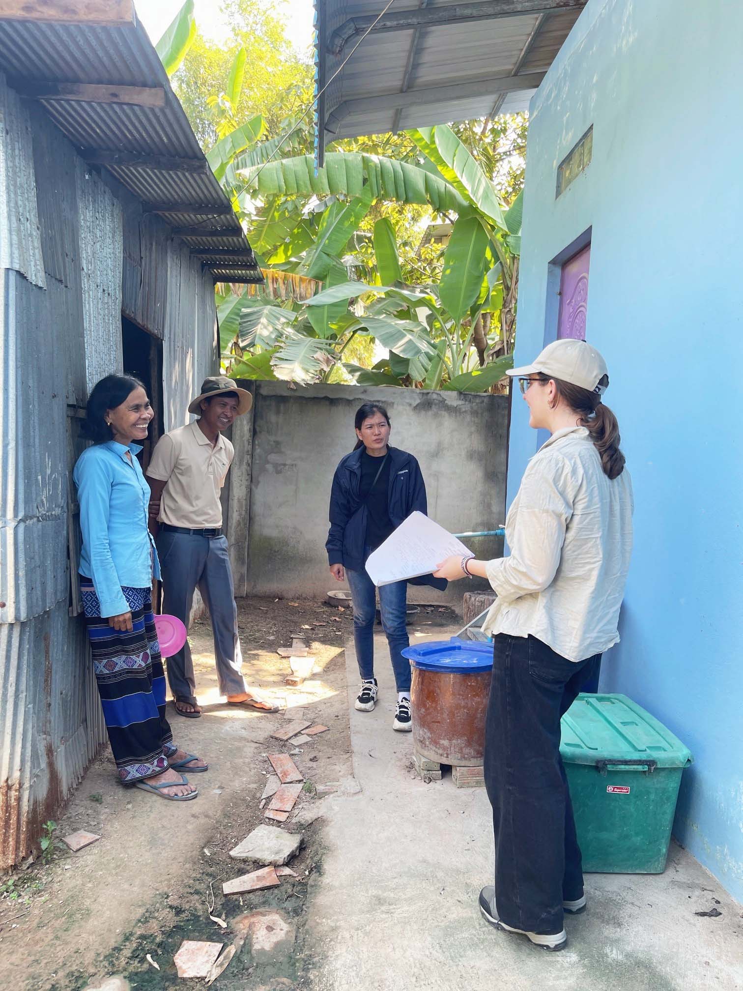 UBC Science Co-op student Ellen Brisley speaks with folks in Cambodia.