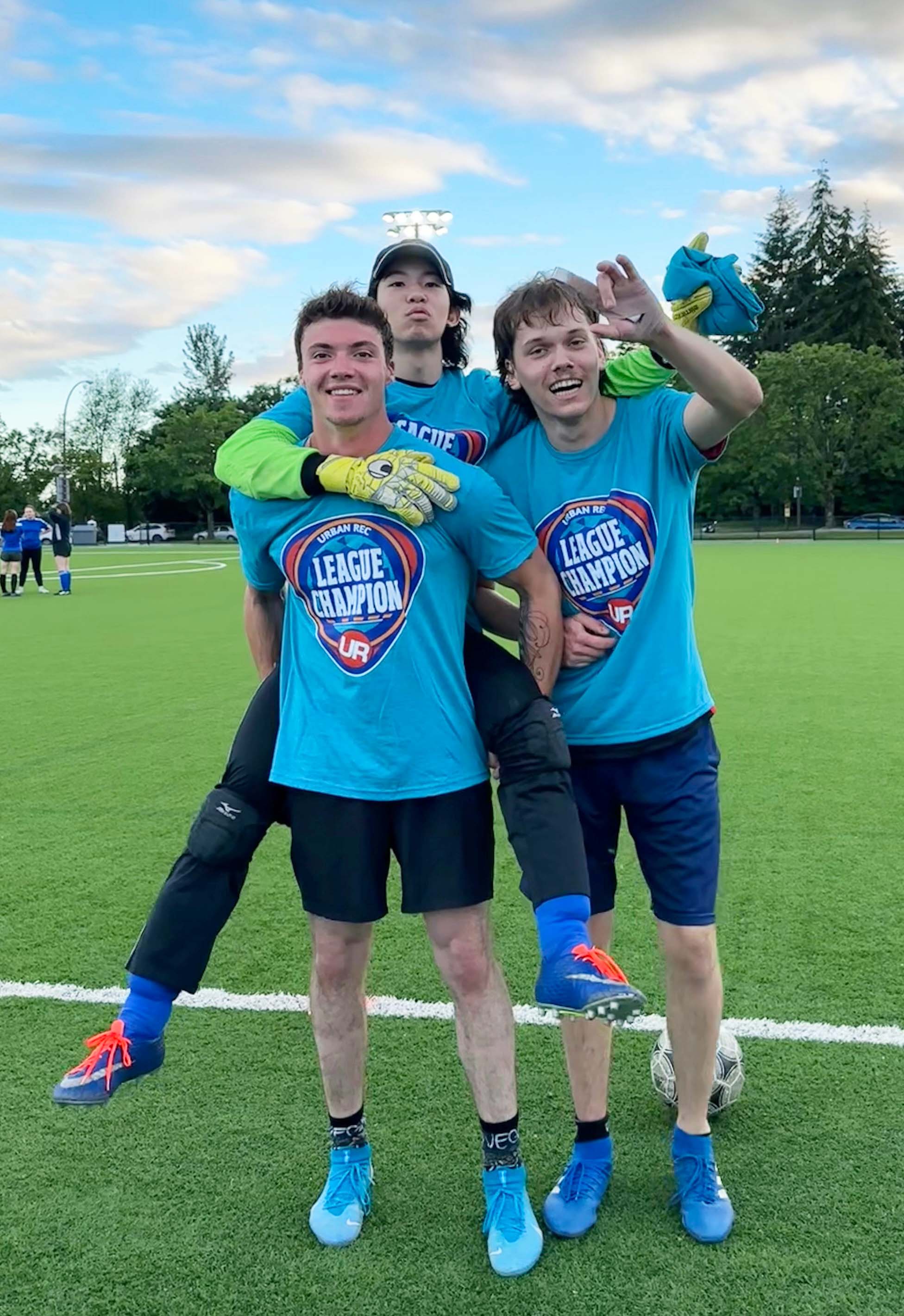 Daichi Furukawa with two Mastercard soccer teammates.