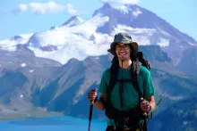 UBC Science Co-op Biology student Elliott Evans hikes in the snow-capped British Columbia mountains.